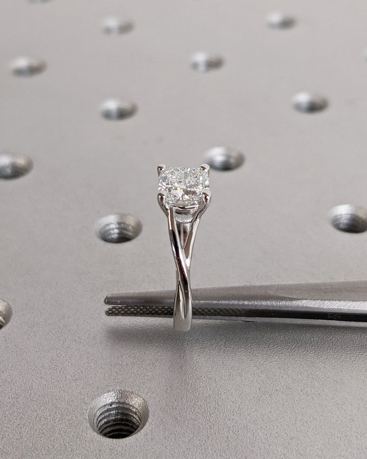 Lifestyle shot of cushion split shank diamond ring on hand