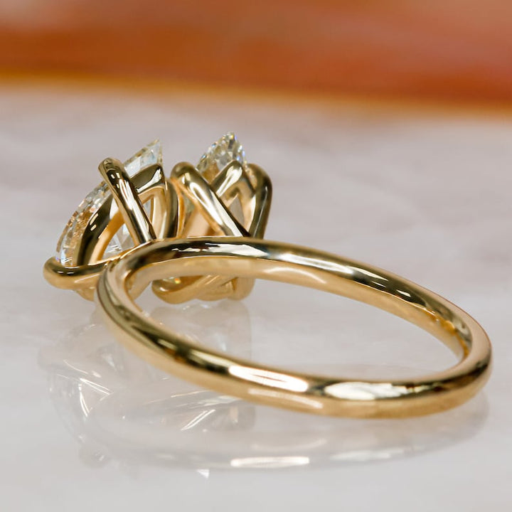 Side angle of pear solitaire diamond engagement ring