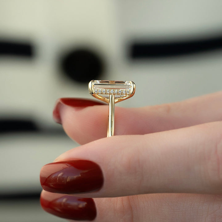 Certified emerald cut diamond featured in hidden halo engagement ring
