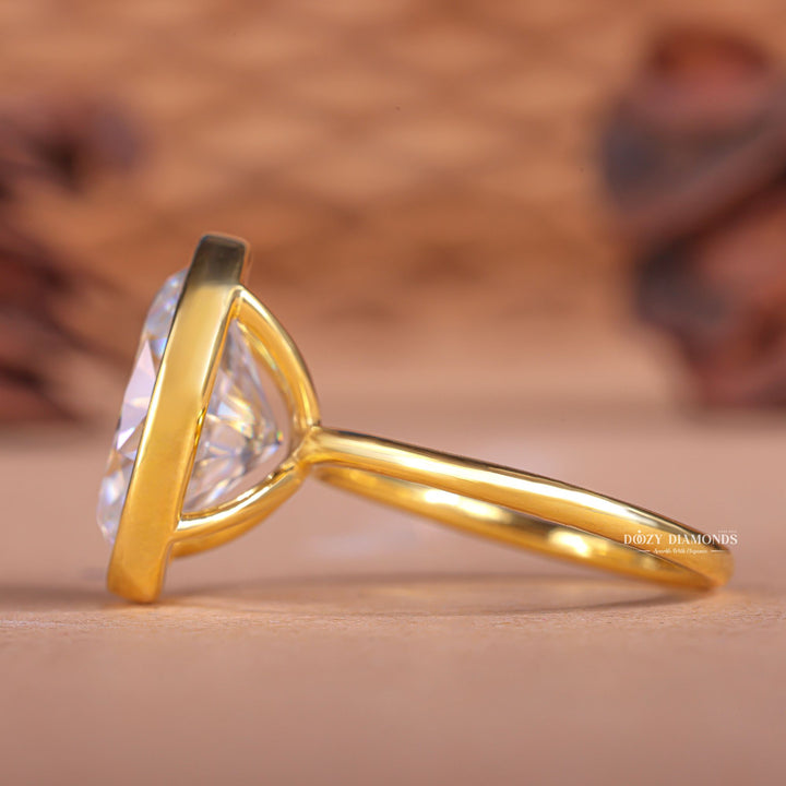 Oval bezel diamond engagement ring available in multiple metals