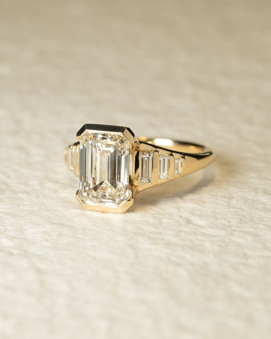 Emerald solitaire engagement ring offered in gold and platinum