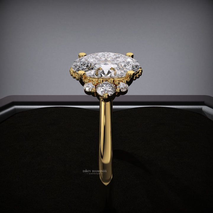 Profile view of oval cut cluster engagement ring band