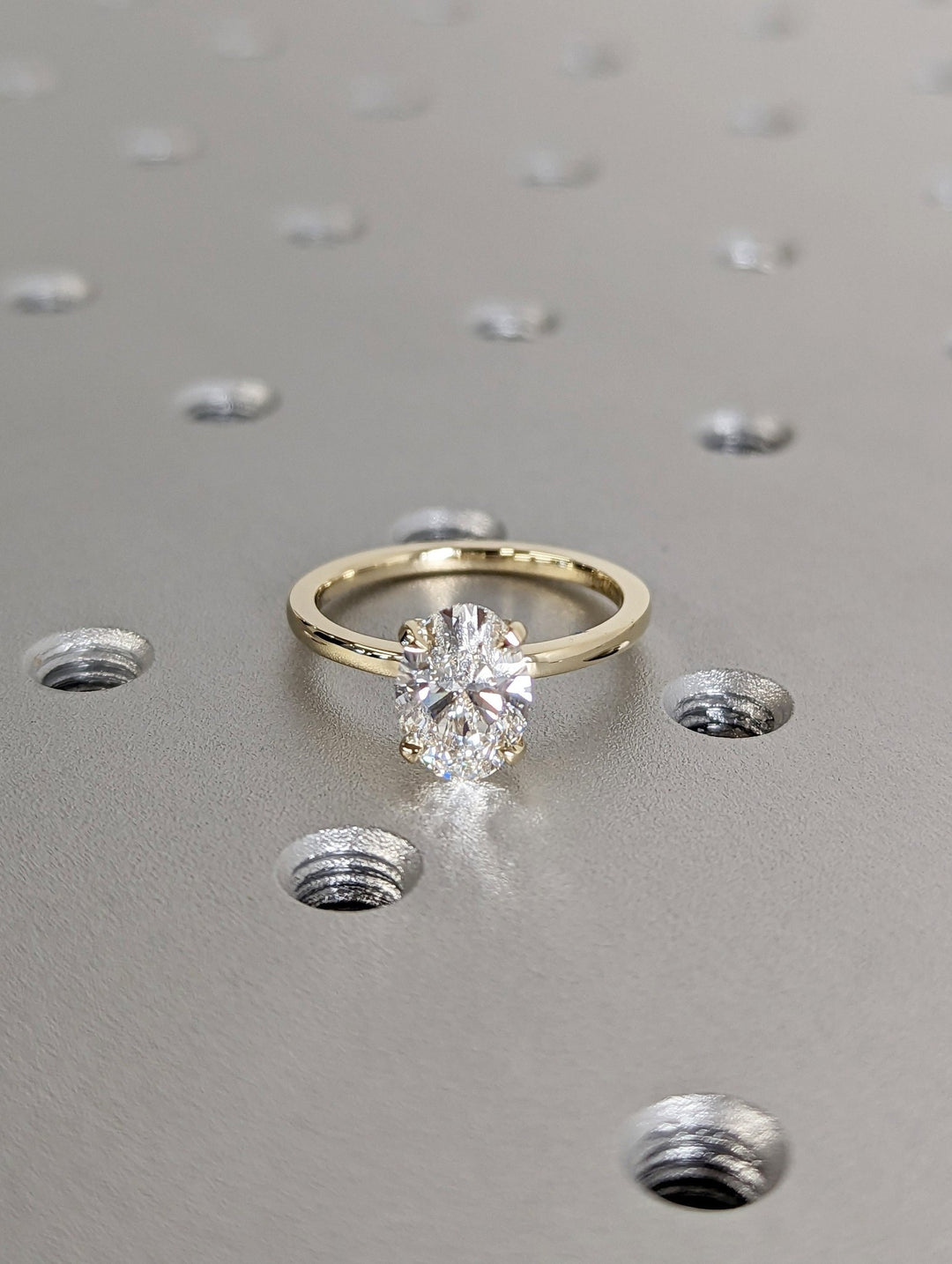 Oval cut solitaire engagement ring shown in real-life wear