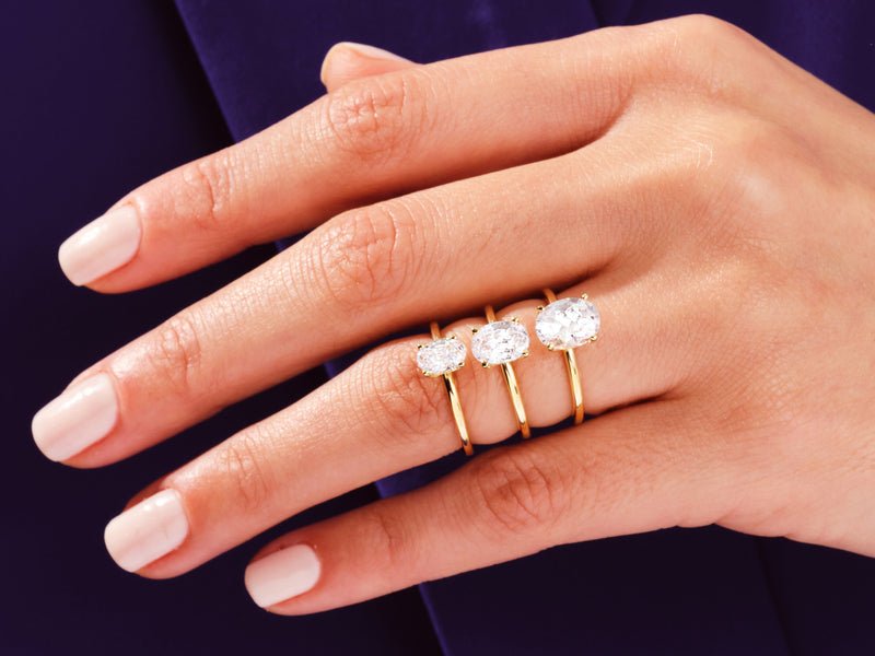 Detailed close-up of oval solitaire diamond engagement ring