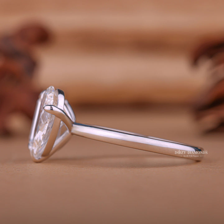 Profile view of pear cut solitaire engagement ring band