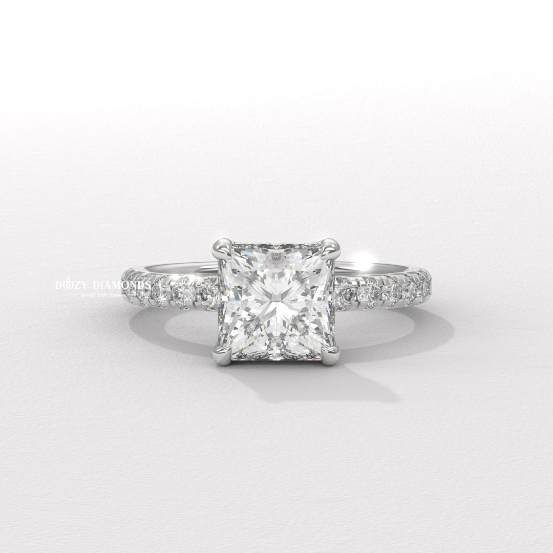 Detailed close-up of princess hidden halo diamond engagement ring