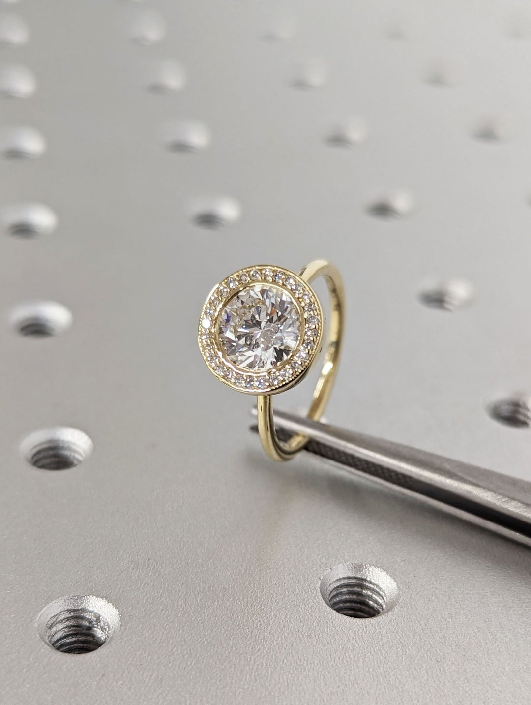 Round solitaire engagement ring photographed in natural light
