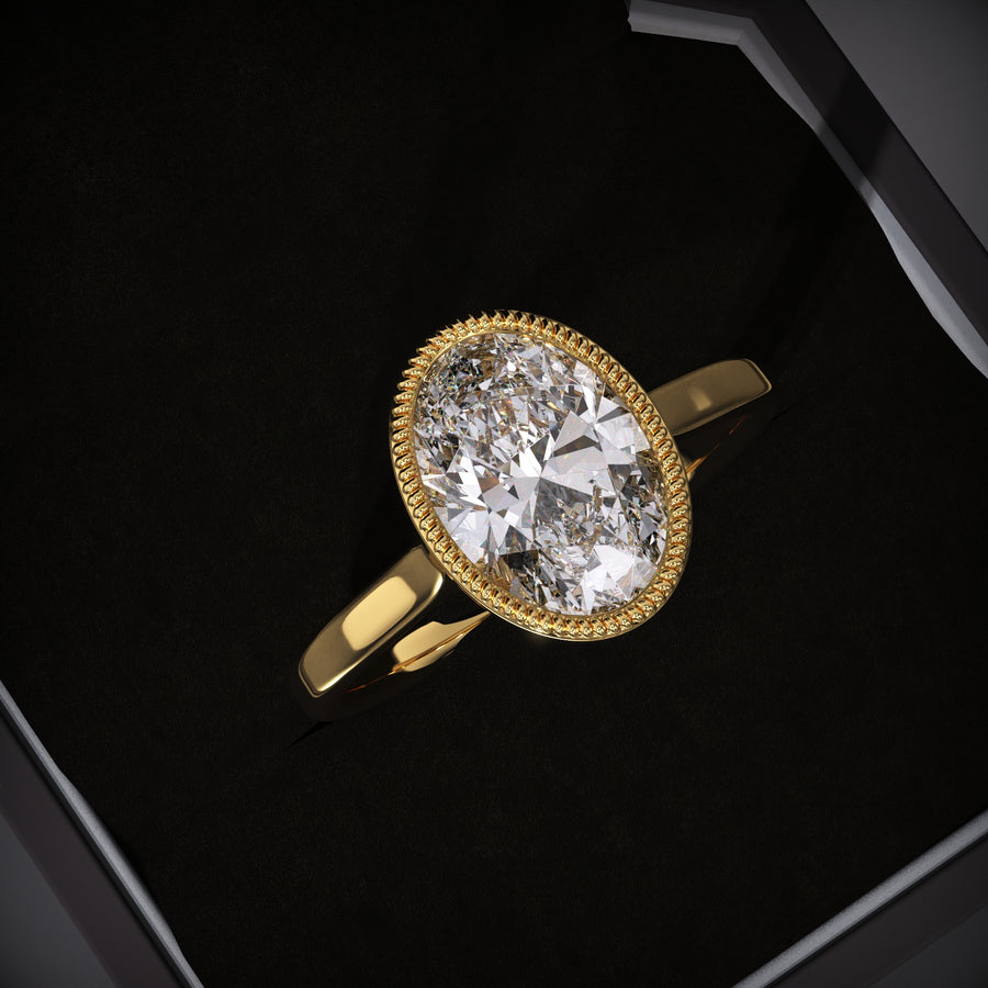 Oval cut bezel engagement ring available to buy now