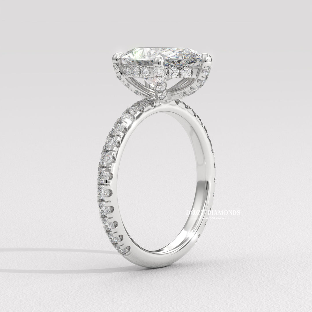 Angled view of pear cut diamond in hidden halo setting