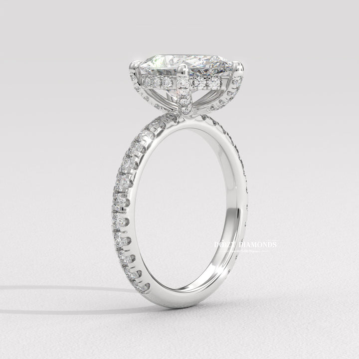 Angled view of pear cut diamond in hidden halo setting