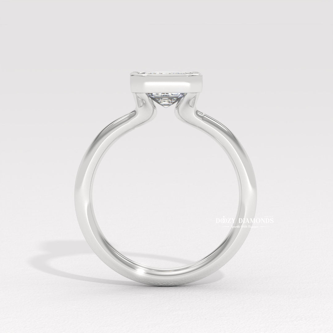 Profile view of emerald cut bezel engagement ring band