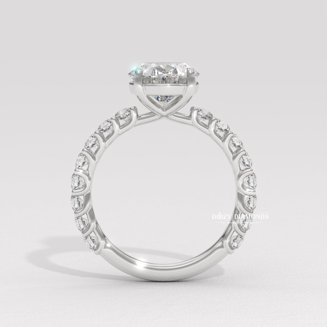 Detailed close-up of oval pave diamond engagement ring