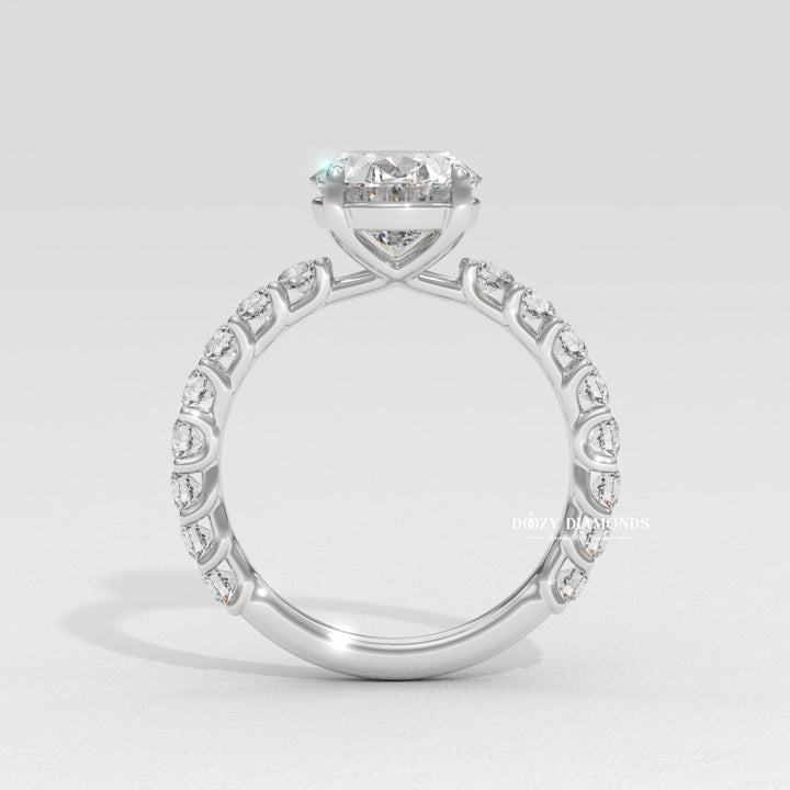 Detailed close-up of oval pave diamond engagement ring
