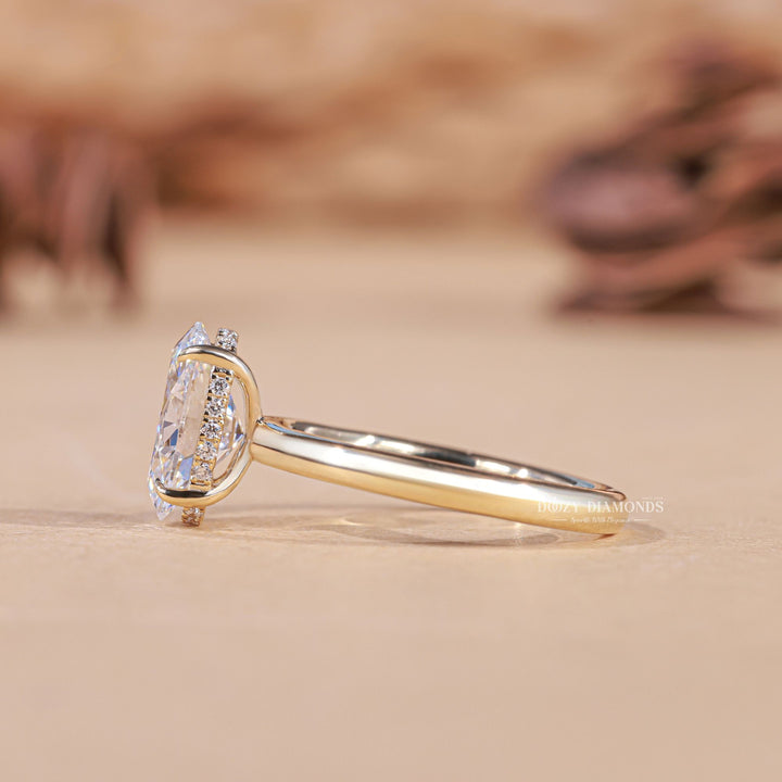 Oval cut engagement ring shown with authenticity certificate