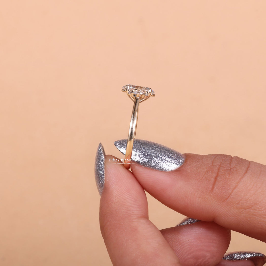 Oval cut cluster engagement ring shown in real-life wear
