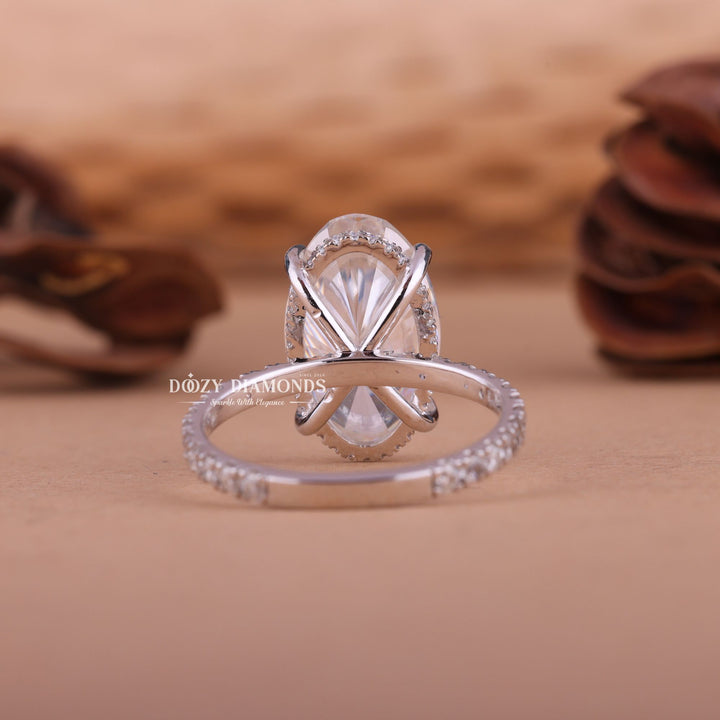 Oval hidden halo ring set with an IGI graded diamond
