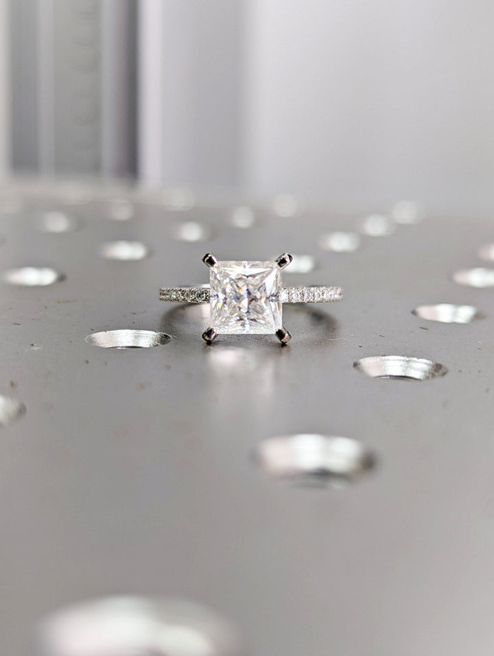 Princess cut engagement ring side view showing band detail