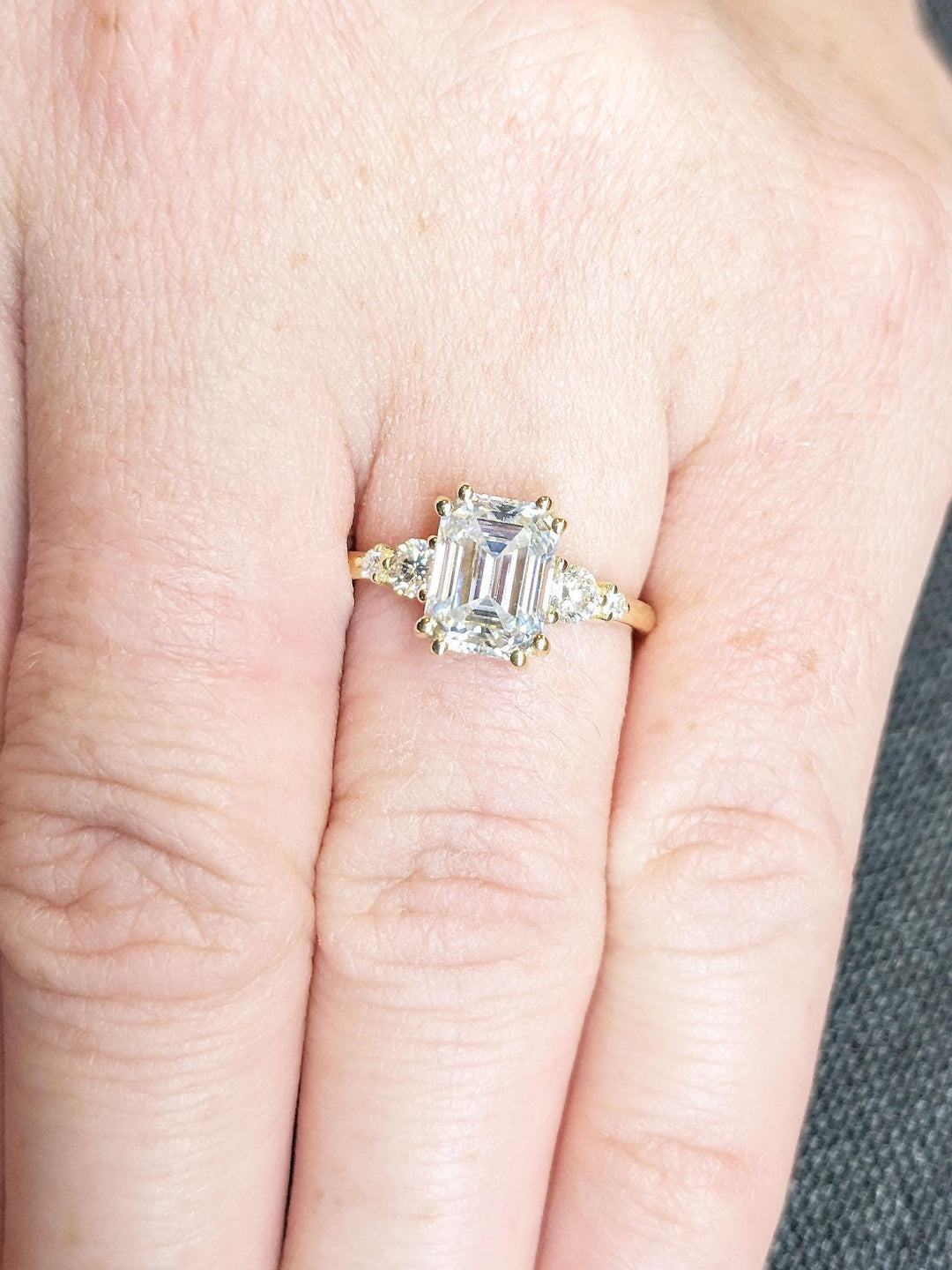 Shop the emerald cut cluster engagement ring collection online