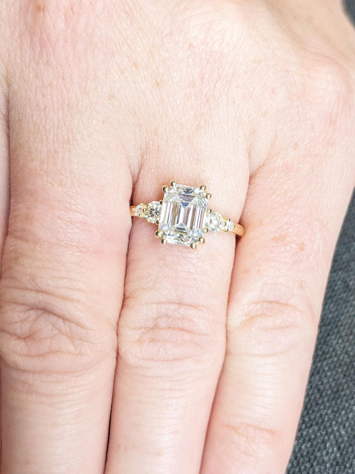 Shop the emerald cut cluster engagement ring collection online