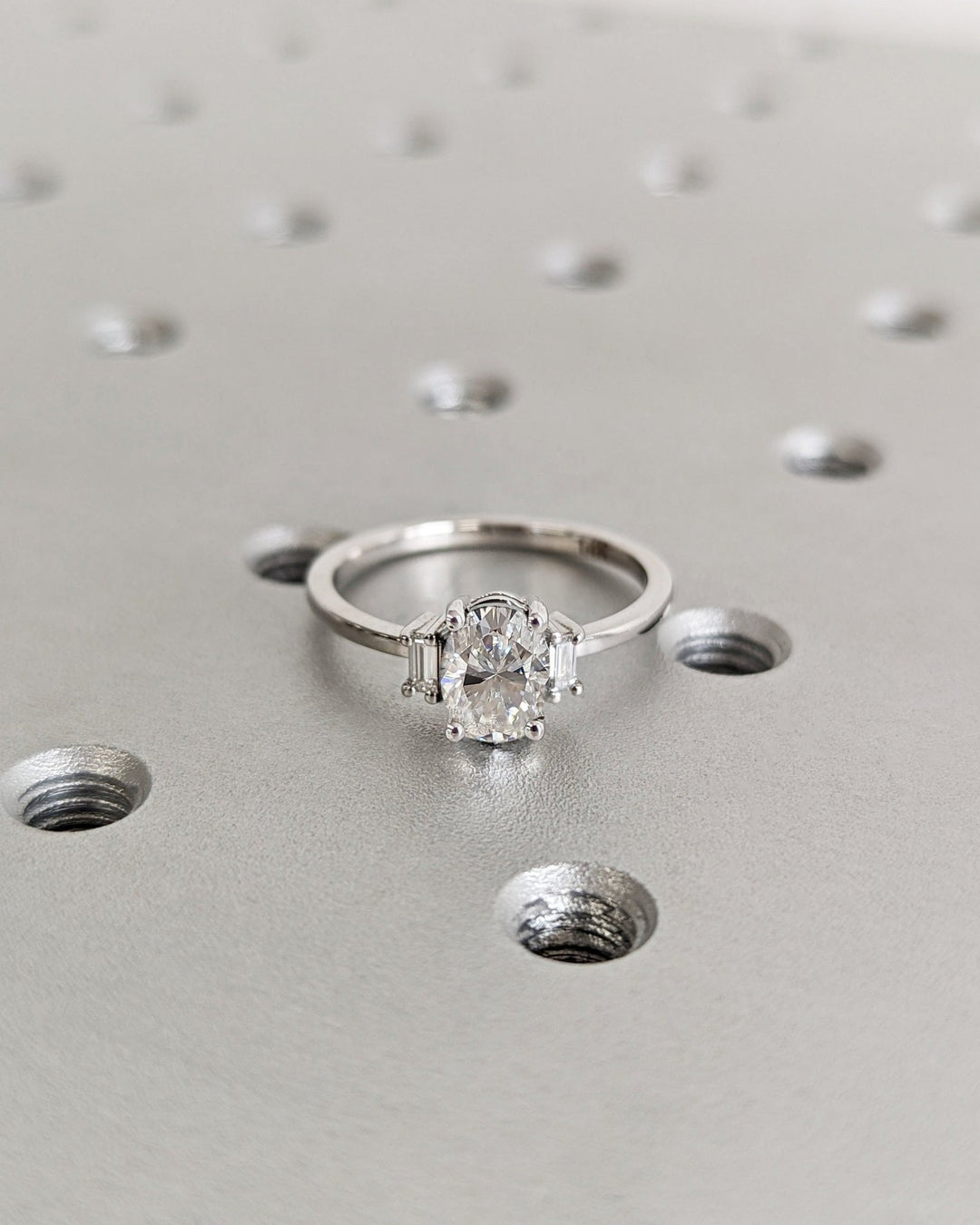 Close-up of oval cut center diamond in solitaire engagement ring