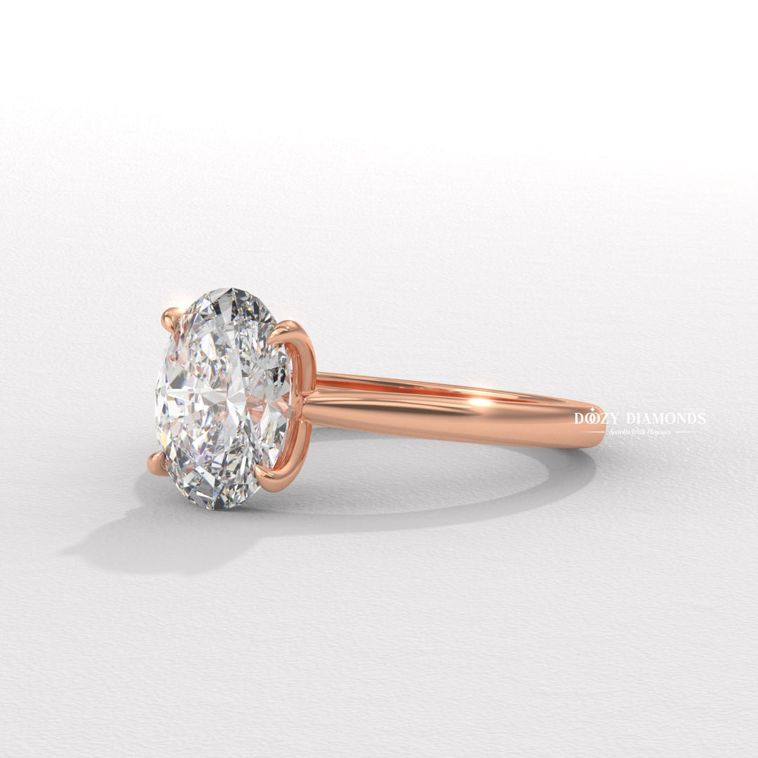 Oval solitaire engagement ring finished in polished solid gold
