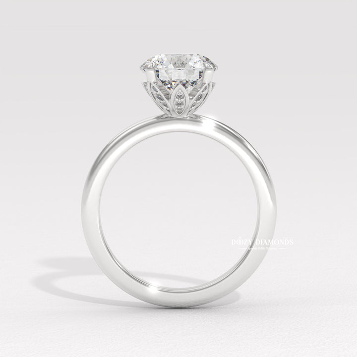 Round solitaire lab grown diamond ring fitted on finger