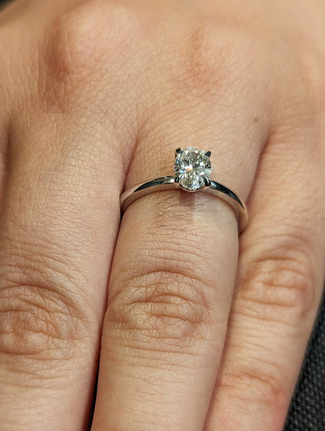 Oval solitaire engagement ring with brilliant diamond sparkle
