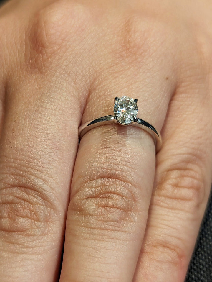 Oval solitaire engagement ring with brilliant diamond sparkle