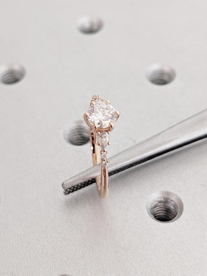 Round cluster lab grown diamond ring fitted on finger