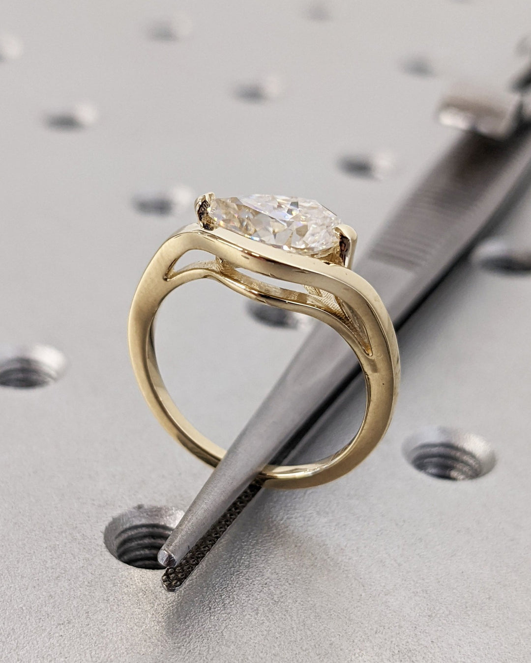 Pear solitaire diamond ring presented in signature gift packaging