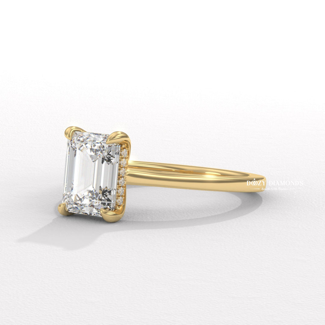 Emerald cut engagement ring shown with authenticity certificate