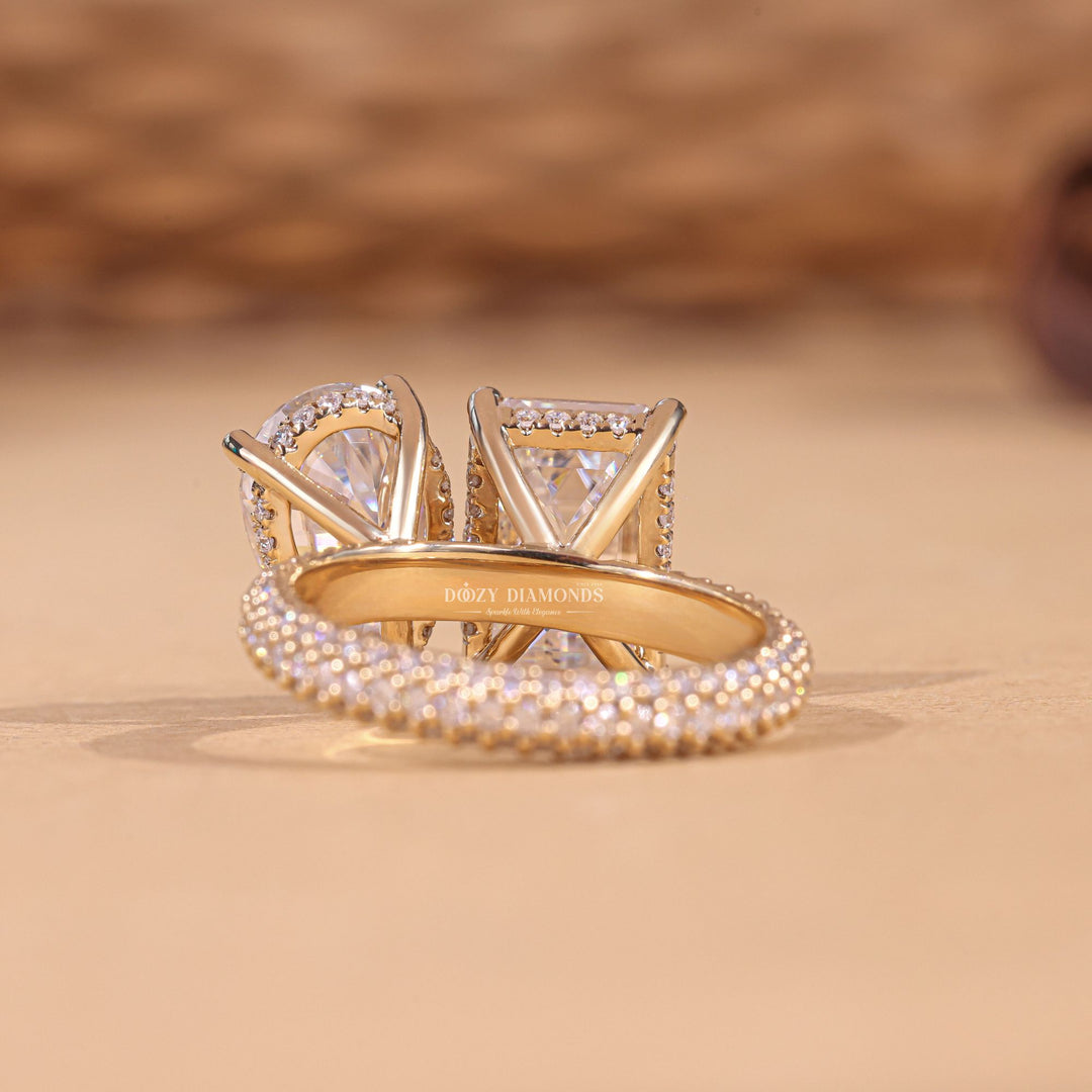 Pear pave diamond ring displayed on jewelry stand
