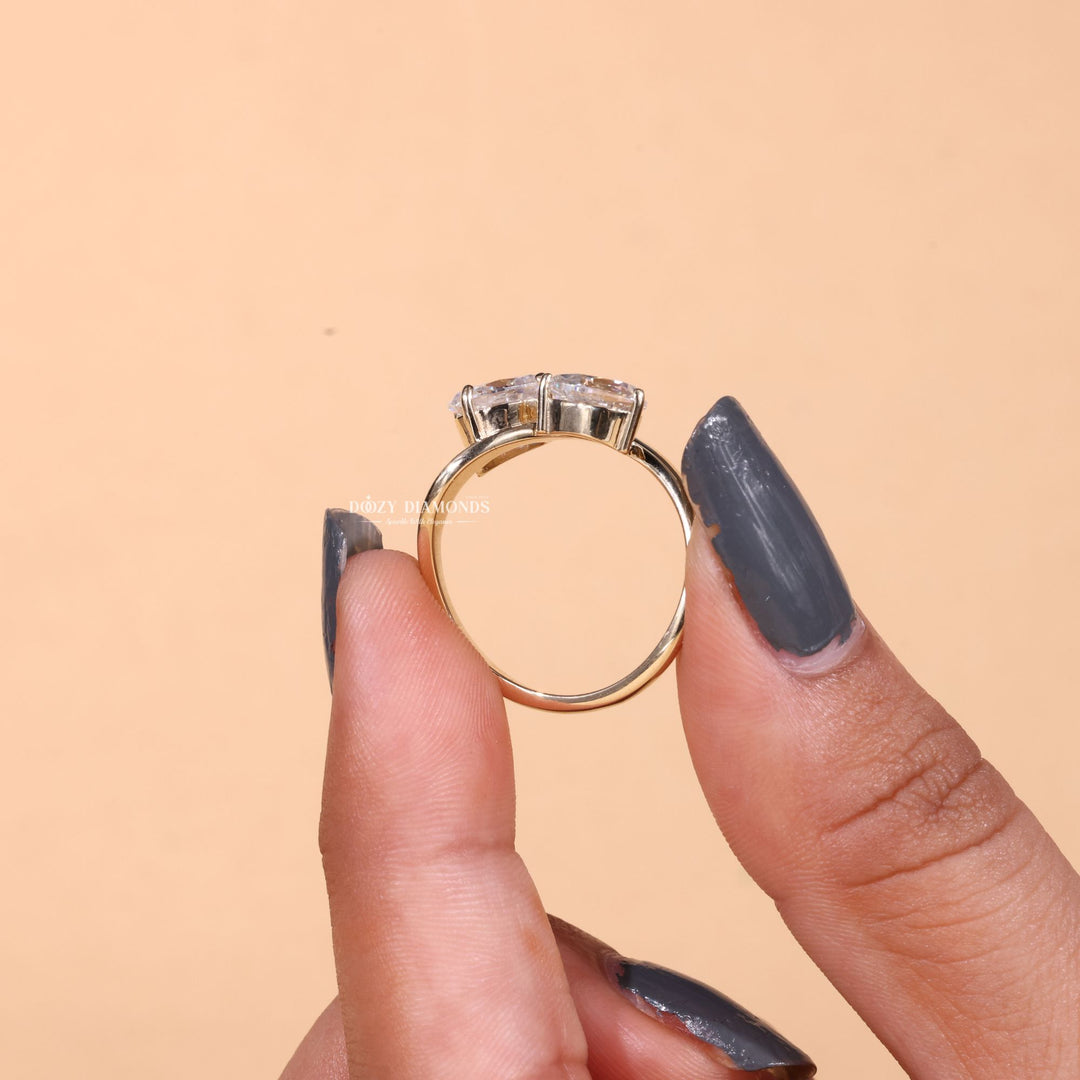 Oval solitaire diamond ring displayed on jewelry stand