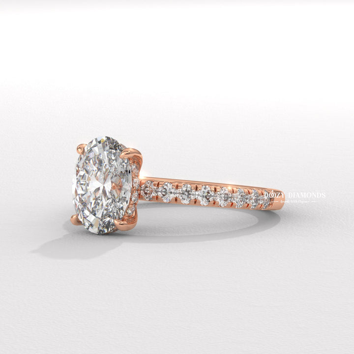 Detailed close-up of oval hidden halo diamond engagement ring