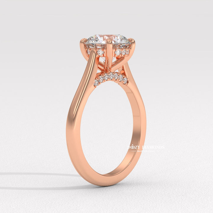 Round hidden halo engagement ring viewed from the side