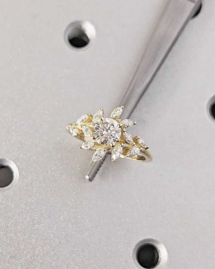 Round cluster diamond engagement ring available in multiple metals
