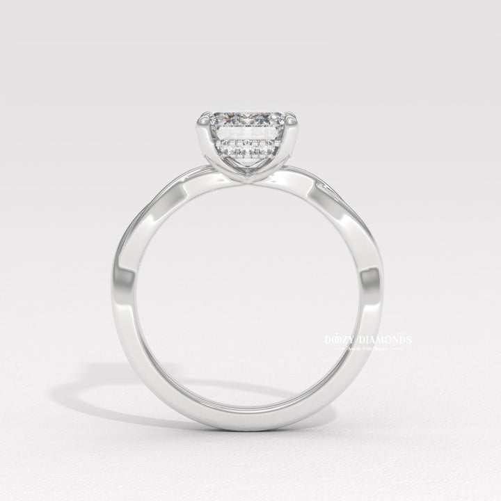 Emerald solitaire engagement ring photographed in natural light