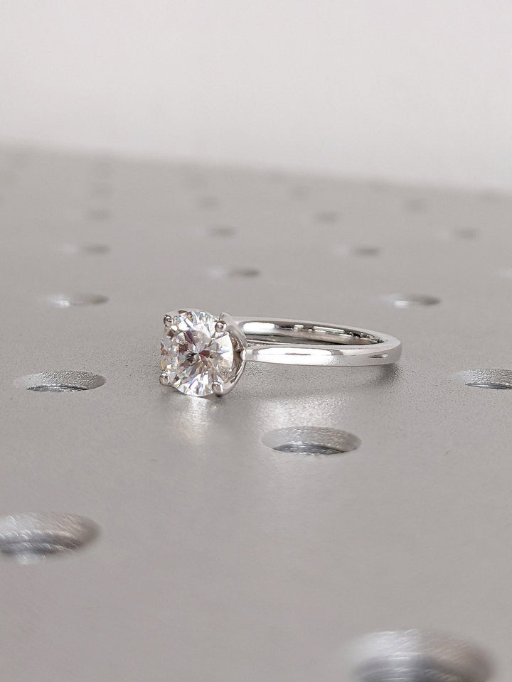 Macro shot of round cut diamond facets in solitaire ring setting