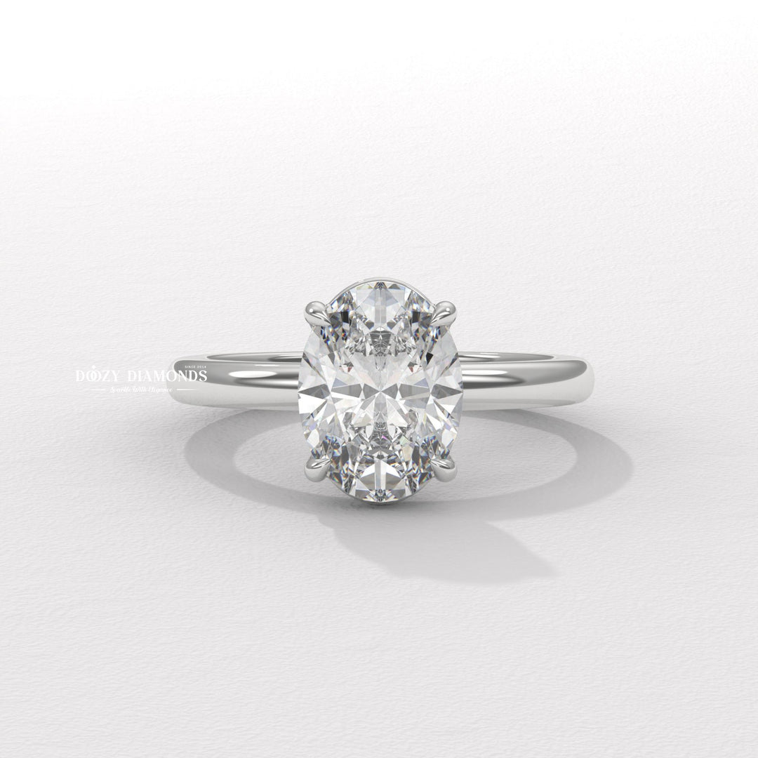 Lifestyle shot of oval solitaire diamond ring on hand