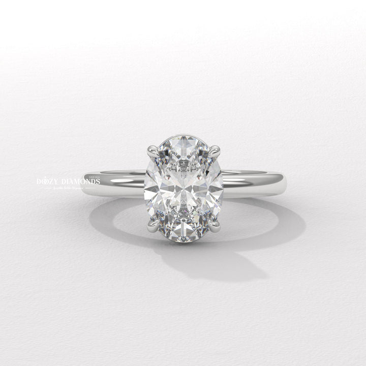 Lifestyle shot of oval solitaire diamond ring on hand