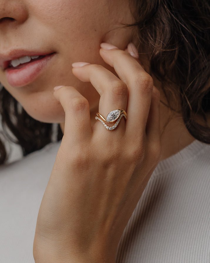 Marquise solitaire engagement ring finished in polished solid gold