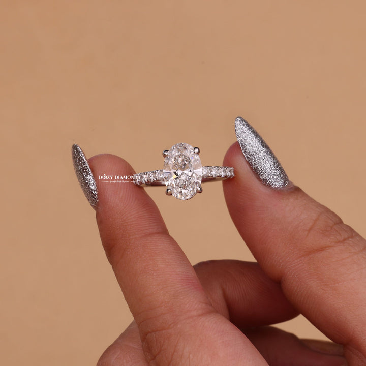 Macro shot of oval cut diamond facets in hidden halo ring setting