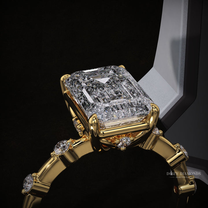 Macro shot of emerald cut diamond facets in pave ring setting