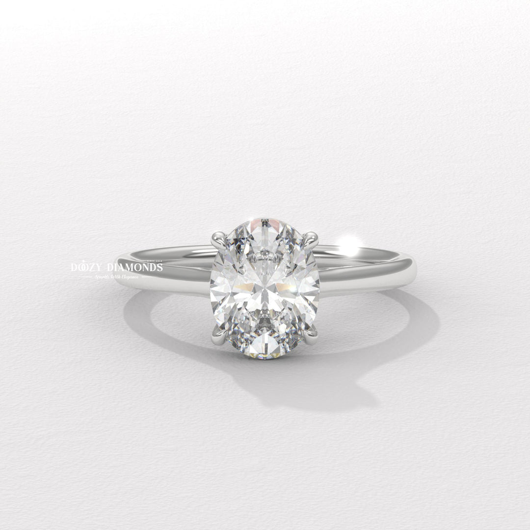 Oval cut diamond ring worn on hand