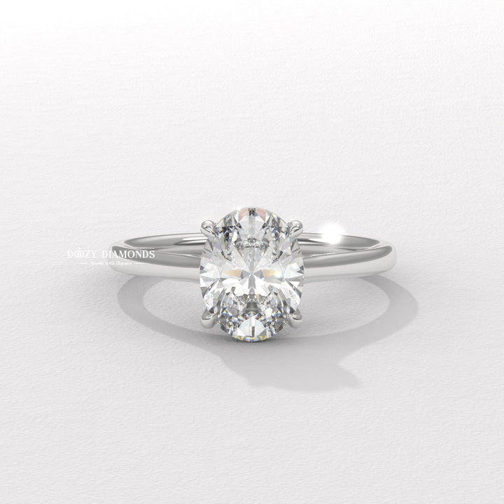 Oval cut diamond ring worn on hand