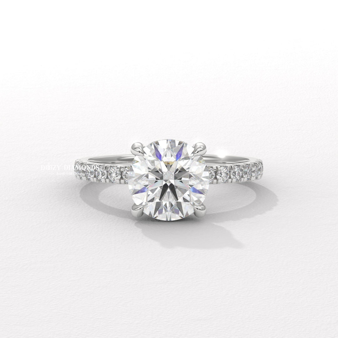 Close-up of round cut center diamond in hidden halo engagement ring