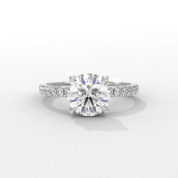 Close-up of round cut center diamond in hidden halo engagement ring