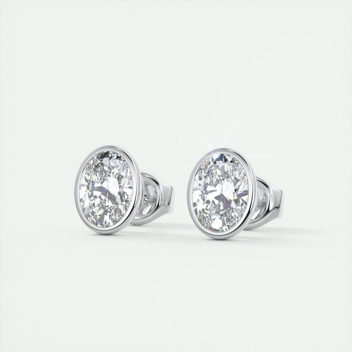 oval-bezel-solitaire-cvd-f-vs-diamond-earrings