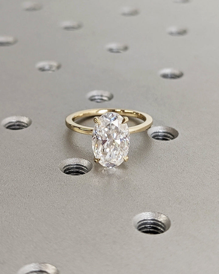 Side angle of oval solitaire diamond engagement ring