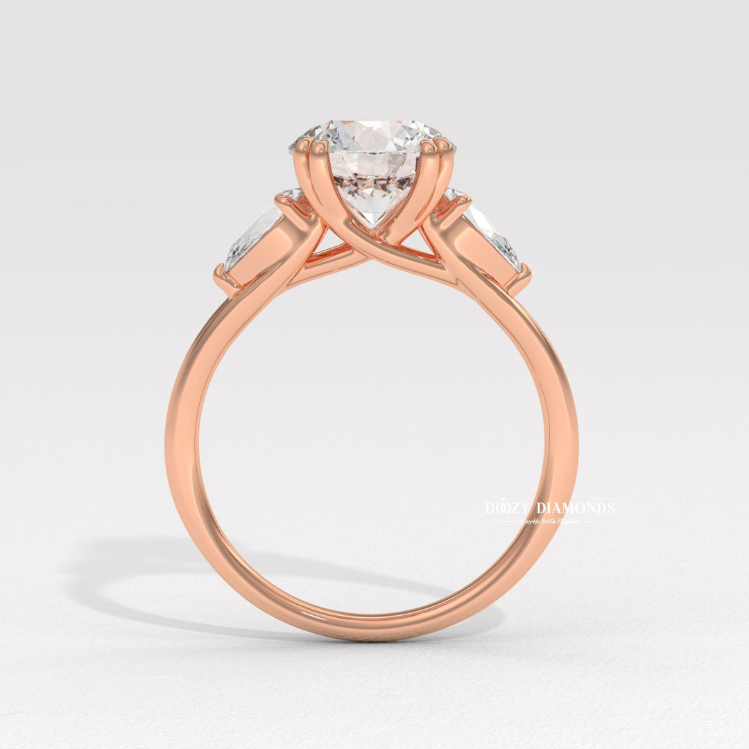 Round cut three stone engagement ring shown in real-life wear